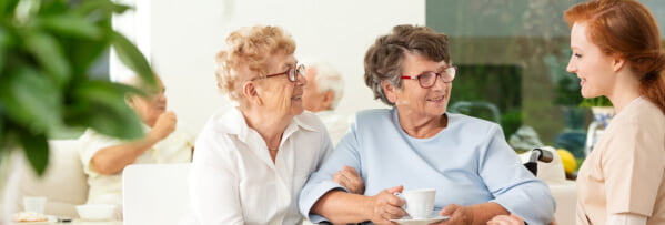 caregiver and elderly woman talking